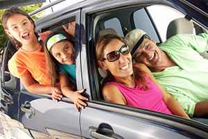 Hispanic family in a car. Family tour in a car.